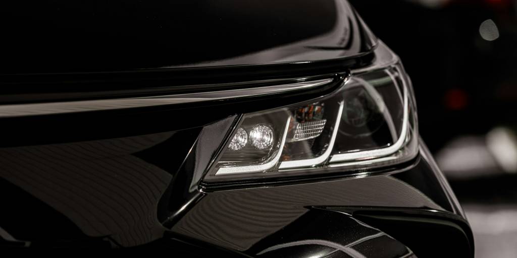 headlight of modern prestigious black car close up.Close up photo of modern car, detail of headlight